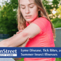 Woman in a pink shirt with an insect bite on her arm. Featured image for Lyme Disease, Tick Bites, and Other Summer Insect Illnesses blog.