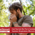 Man sneezing in the summer. Featured image for Can You Get the Flu in Summer? Summer Respiratory Illnesses Explained blog.